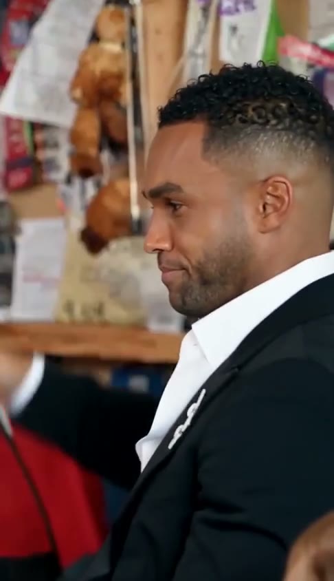 Demo opening frame with the lead vocalist in a black jacket and white shirt