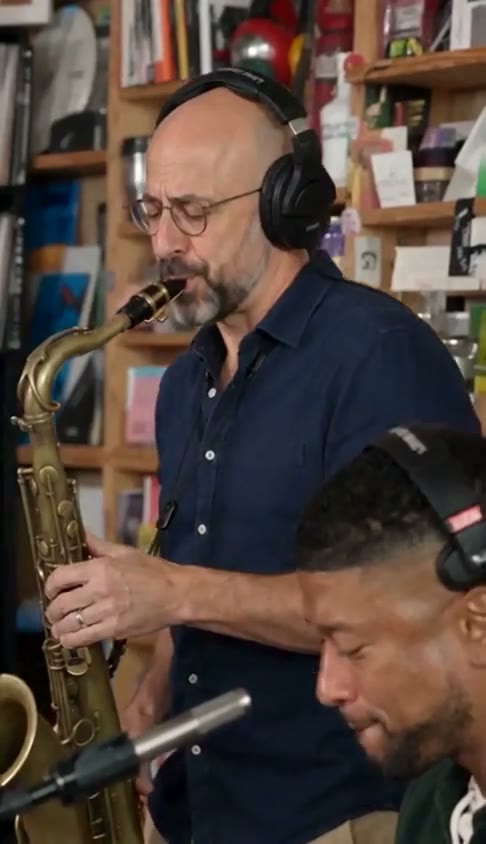 Demo frame of the saxophonist playing with headphones on